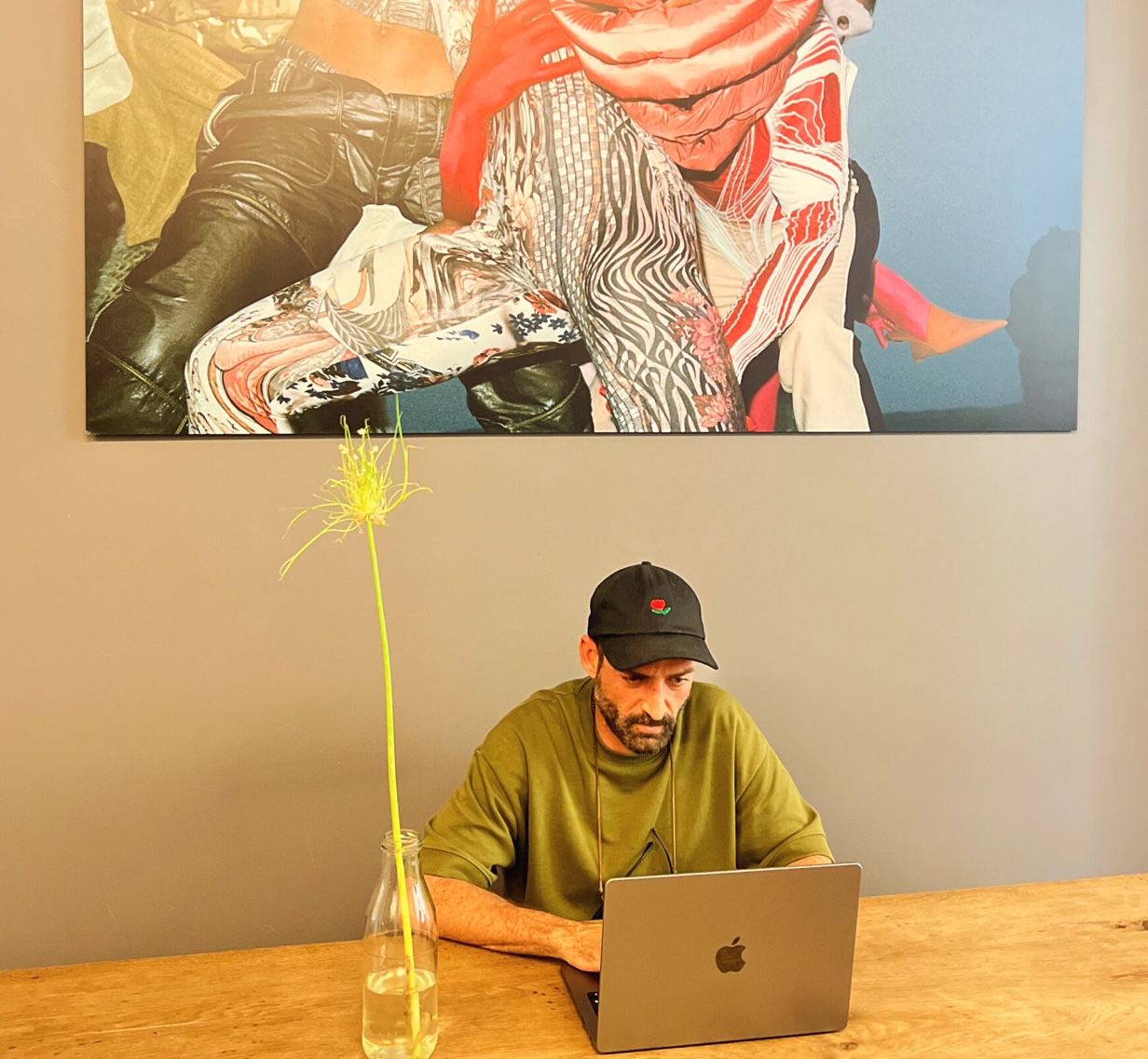 Josua Wilbert working on a laptop